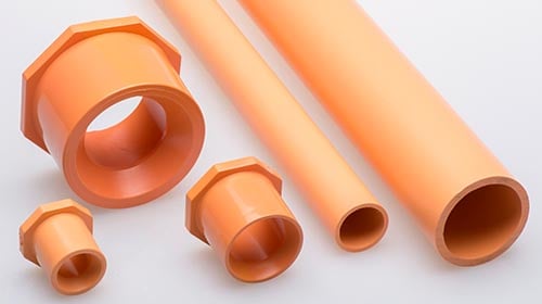 different size and fittings of orange piping