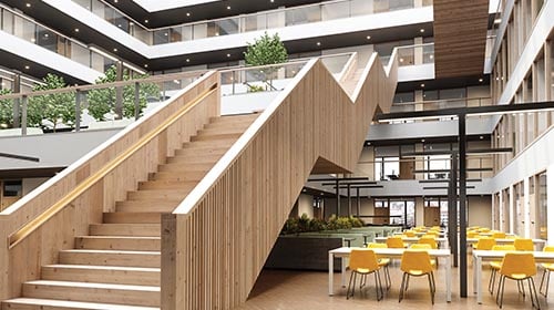 inside view of a modern looking lobby with large staircase