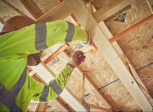 Person applying solvent to ceiling